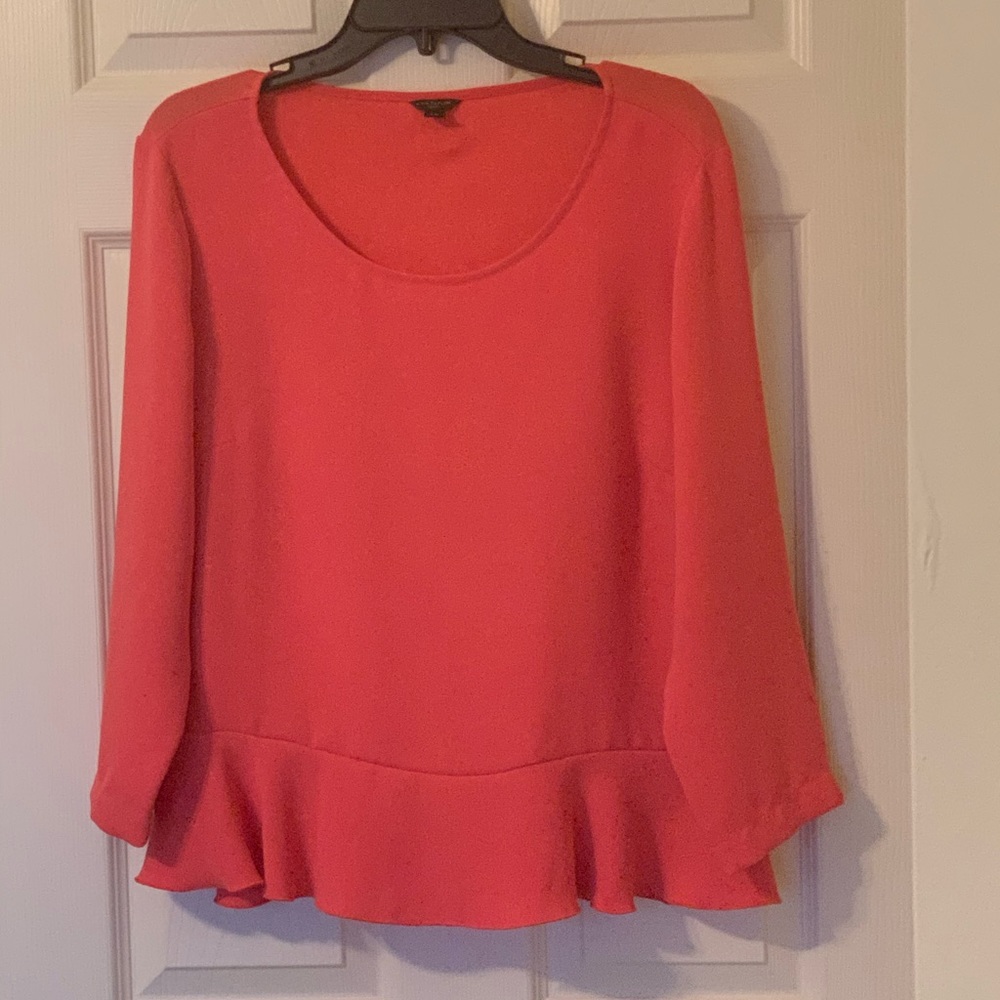 Beautiful coral blouse.